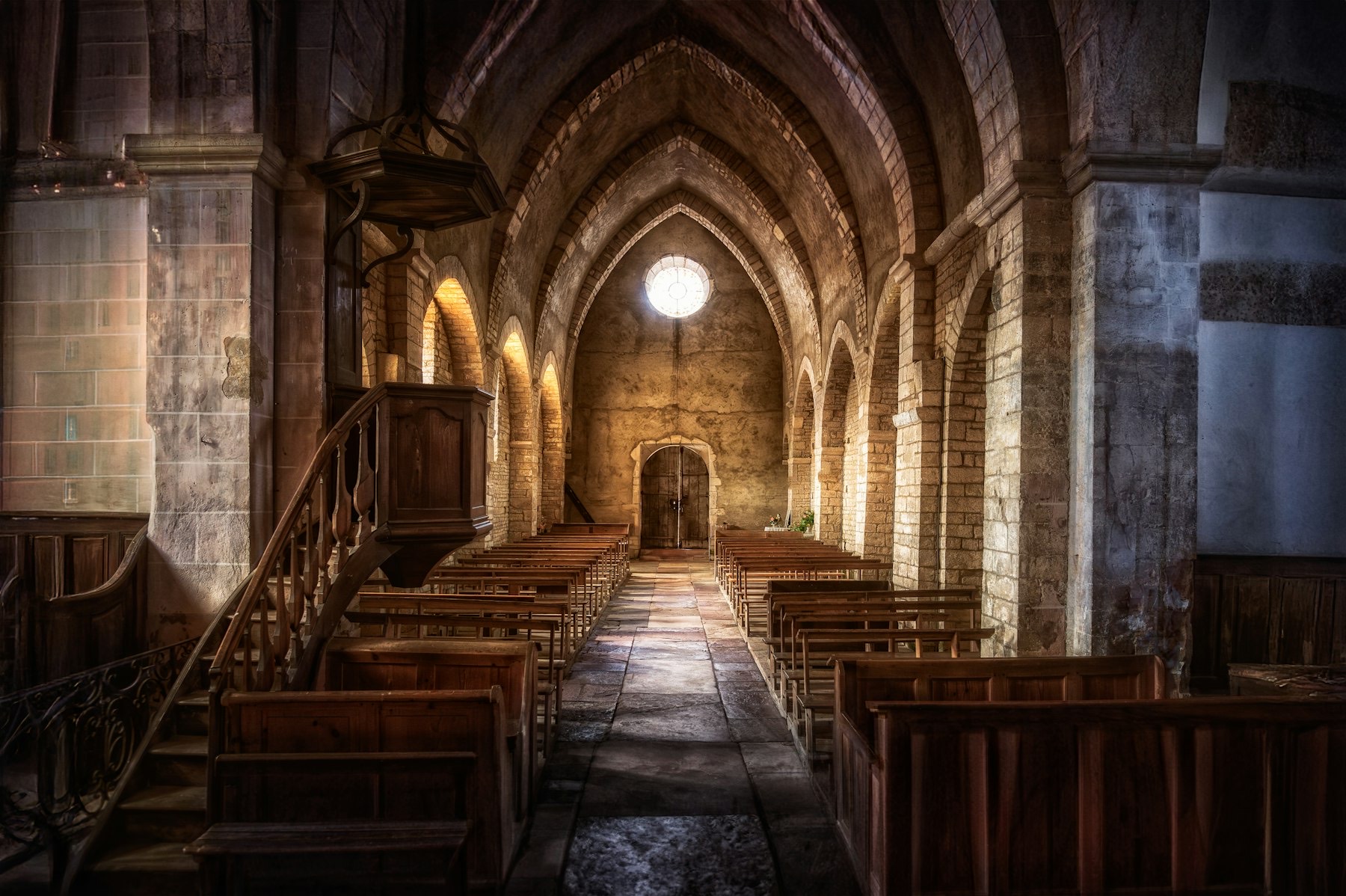 Wooden pews in a quiet church